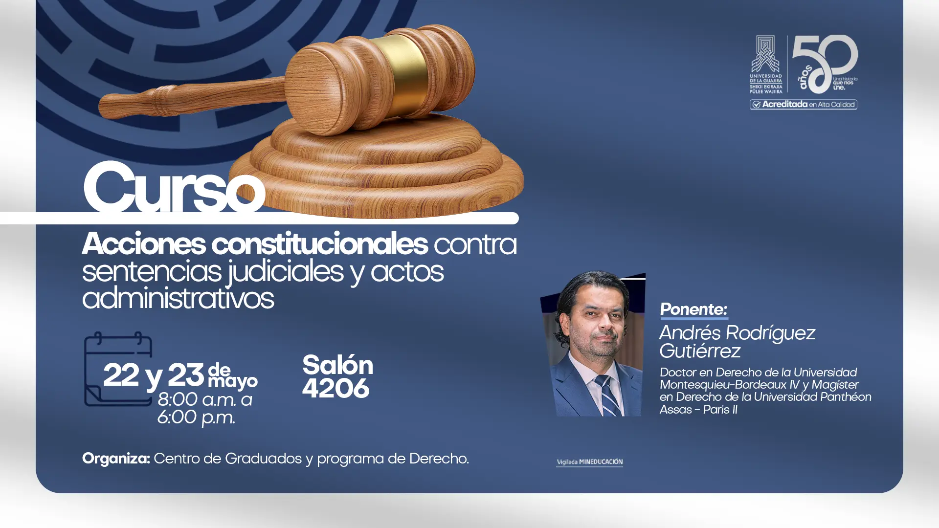 Banner promocional de la Universidad de La Guajira sobre el curso “Acciones constitucionales contra sentencias judiciales y actos administrativos”. El diseño tiene fondo azul institucional con un mazo de juez en la parte superior. Incluye la información del evento: 22 y 23 de mayo, de 8:00 a. m. a 6:00 p. m., en el Salón 4206. Aparece como ponente Andrés Rodríguez Gutiérrez, doctor en Derecho y magíster en Derecho, junto a su fotografía. En la parte superior derecha se observa el logo de la Universidad de La Guajira y la conmemoración de sus 50 años. Organiza el Centro de Graduados y el programa de Derecho.